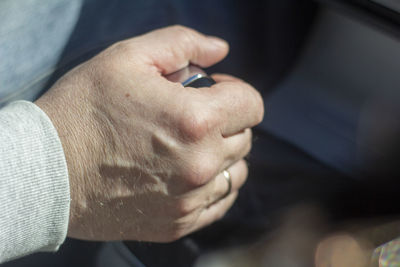 Close-up of man holding hands