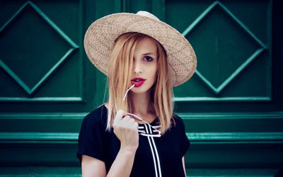 Portrait of a beautiful young woman wearing hat