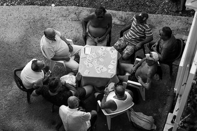 High angle view of people sitting in shop