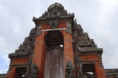 Low angle view of old temple against sky