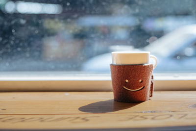 Close-up of coffee cup on table