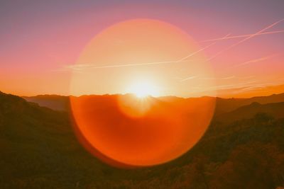 Scenic view of mountains against sky during sunset