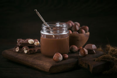 Homemade chocolate hazelnut milk spread on a dark background