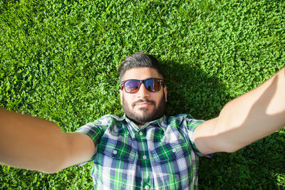 Portrait of young man wearing sunglasses