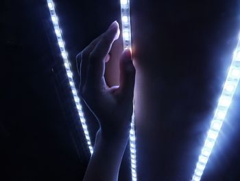 Close-up of hand holding illuminated light