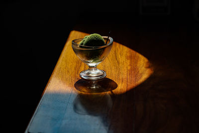 High angle view of green tea ice cream glasses on table