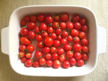 High angle view of strawberries in bowl on table