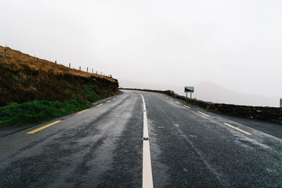 Country road against clear sky