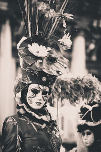 Woman wearing venetian mask at carnival of venice