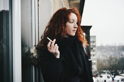 Young woman smoking cigarette