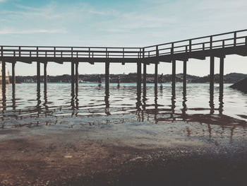 Bridge over sea against sky