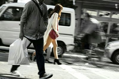 Woman walking on city street