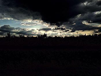 Scenic view of landscape against cloudy sky