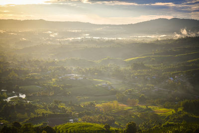 Aerial view of townscape against sky during sunset