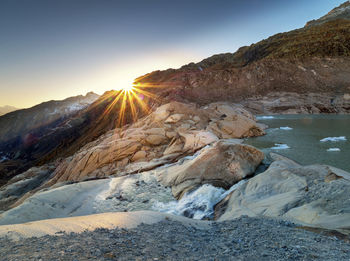 Scenic view of mountain against sky during sunset