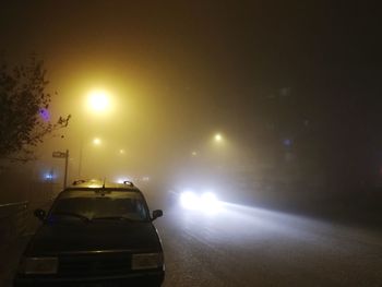 Cars on road at night