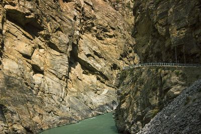 Scenic view of river amidst cliff