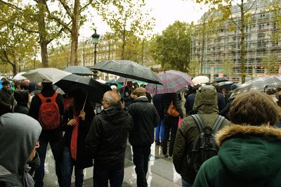 People looking at city street