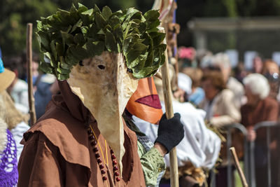 Man wearing costume on street during festival