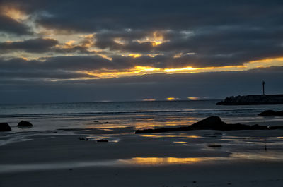 Scenic view of sea against sky at sunset