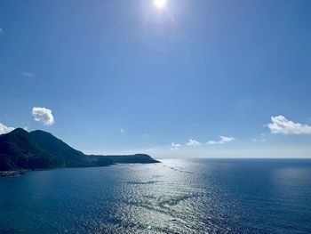 Scenic view of sea against blue sky