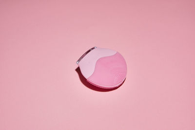 High angle view of pink umbrella against gray background
