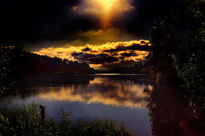 Scenic view of lake against sky during sunset