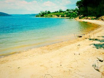 View of calm beach against sky