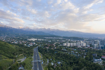 High angle view of buildings in city against sky