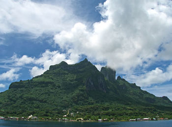 Scenic view of mountains and sea against sky