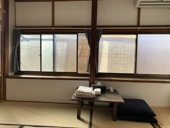 Empty chairs and table in building