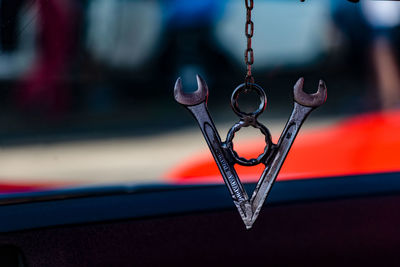 Close-up of decoration hanging in car