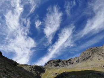 Low angle view of mountain against blue sky