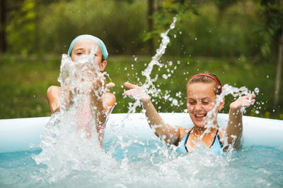 Portrait of happy woman in swimming pool