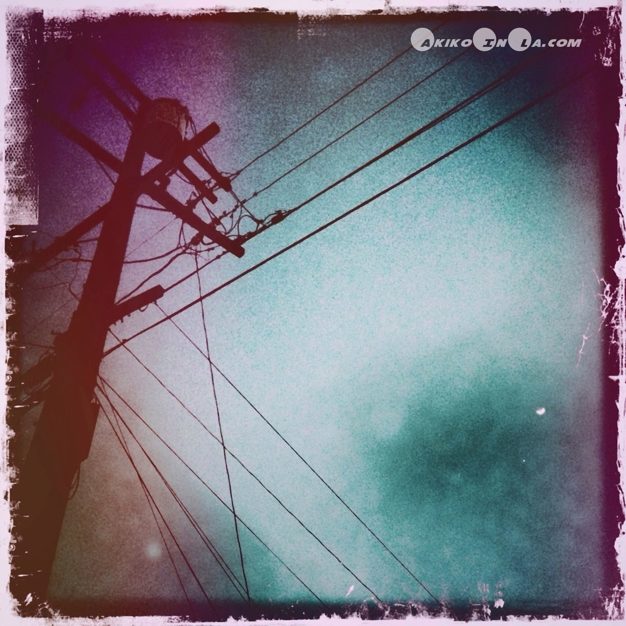 transfer print, low angle view, power line, electricity, connection, power supply, auto post production filter, cable, electricity pylon, technology, fuel and power generation, sky, built structure, outdoors, transportation, no people, day, architecture, power cable, dusk