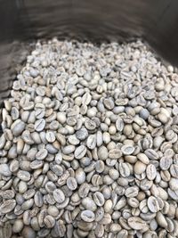 High angle view of pebbles in container