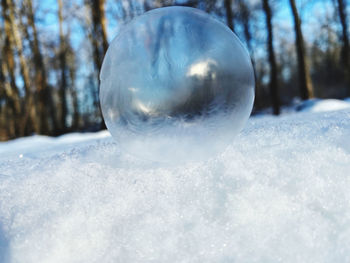 Close-up of crystal ball on snow