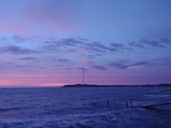 Scenic view of sea against sky at sunset