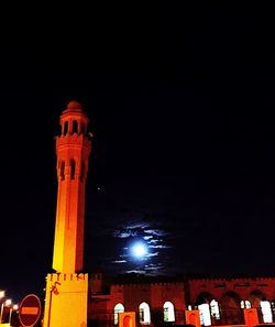 Low angle view of illuminated building at night