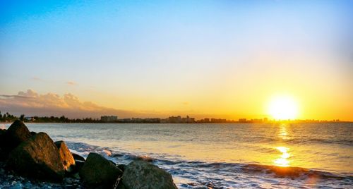 Scenic view of sea against sky during sunset