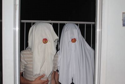 Portrait of people standing by window