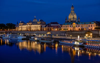 Reflection of illuminated buildings in water at night