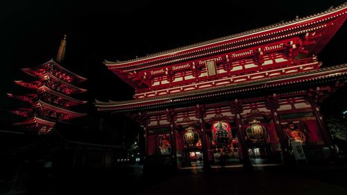 Low angle view of illuminated building at night