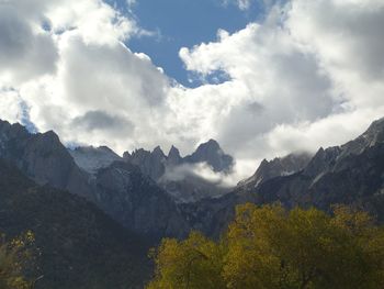 Scenic view of mountains against cloudy sky