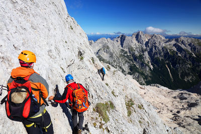 Panoramic view of people on mountain against sky