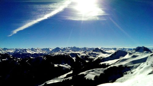 Scenic view of snow covered mountains against sky