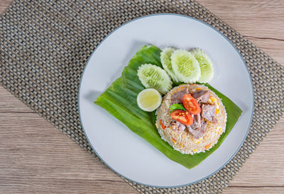 High angle view of vegetables in plate on table