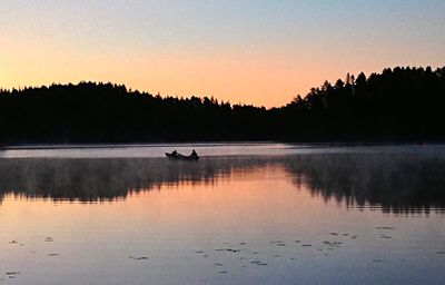 Silhouette of boat at sunset