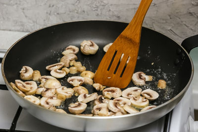 High angle view of meat in cooking pan