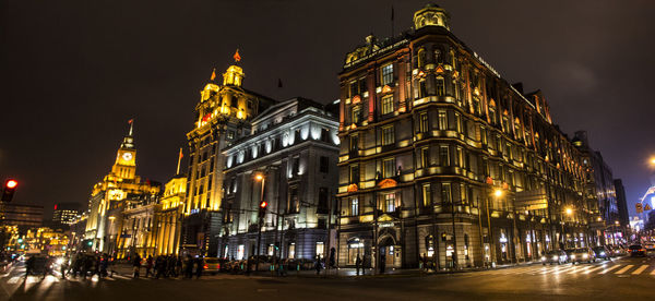 Illuminated buildings in city at night